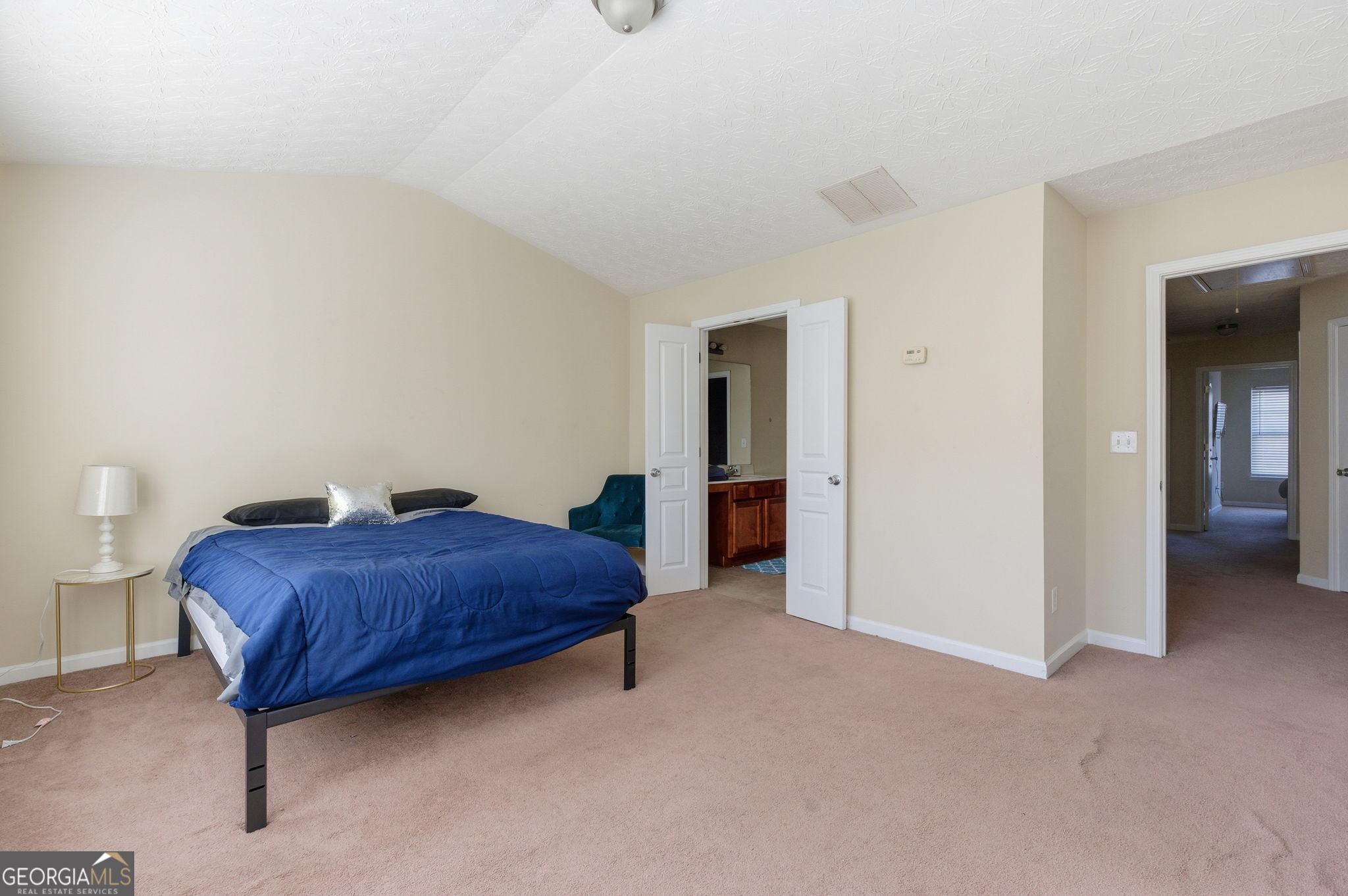 6022 Centennial Run Atlanta, GA 30349 - Photo 15 of 23 a room with a bed and a table in it