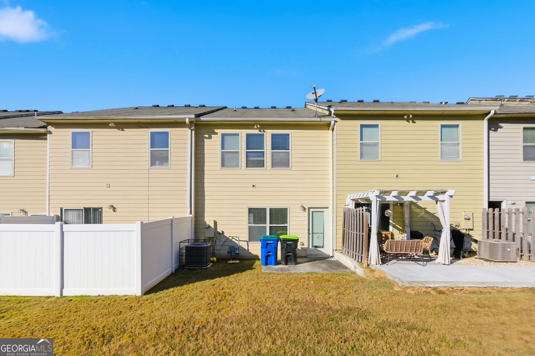 6022 Centennial Run Atlanta, GA 30349 - Photo 23 of 23 a view of a house with a patio