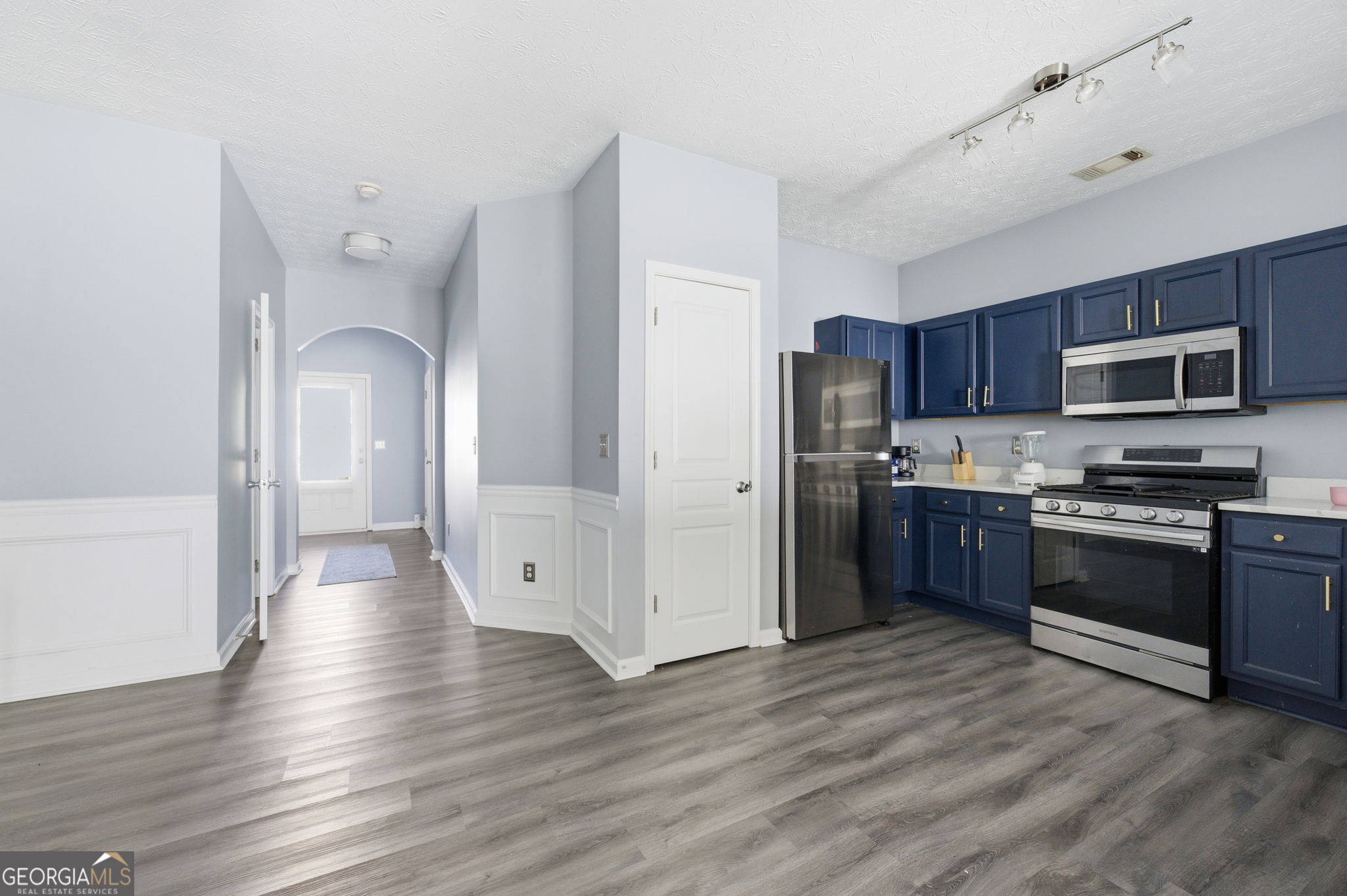 6022 Centennial Run Atlanta, GA 30349 - Photo 8 of 23 a kitchen with stainless steel appliances granite countertop a refrigerator stove and sink