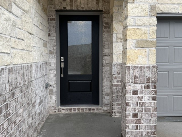 2514 Rose Gold Drive Rosharon, TX 77583 - Photo 2 of 27 a stone house with a door