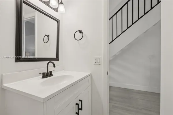 a bathroom with a sink and a mirror