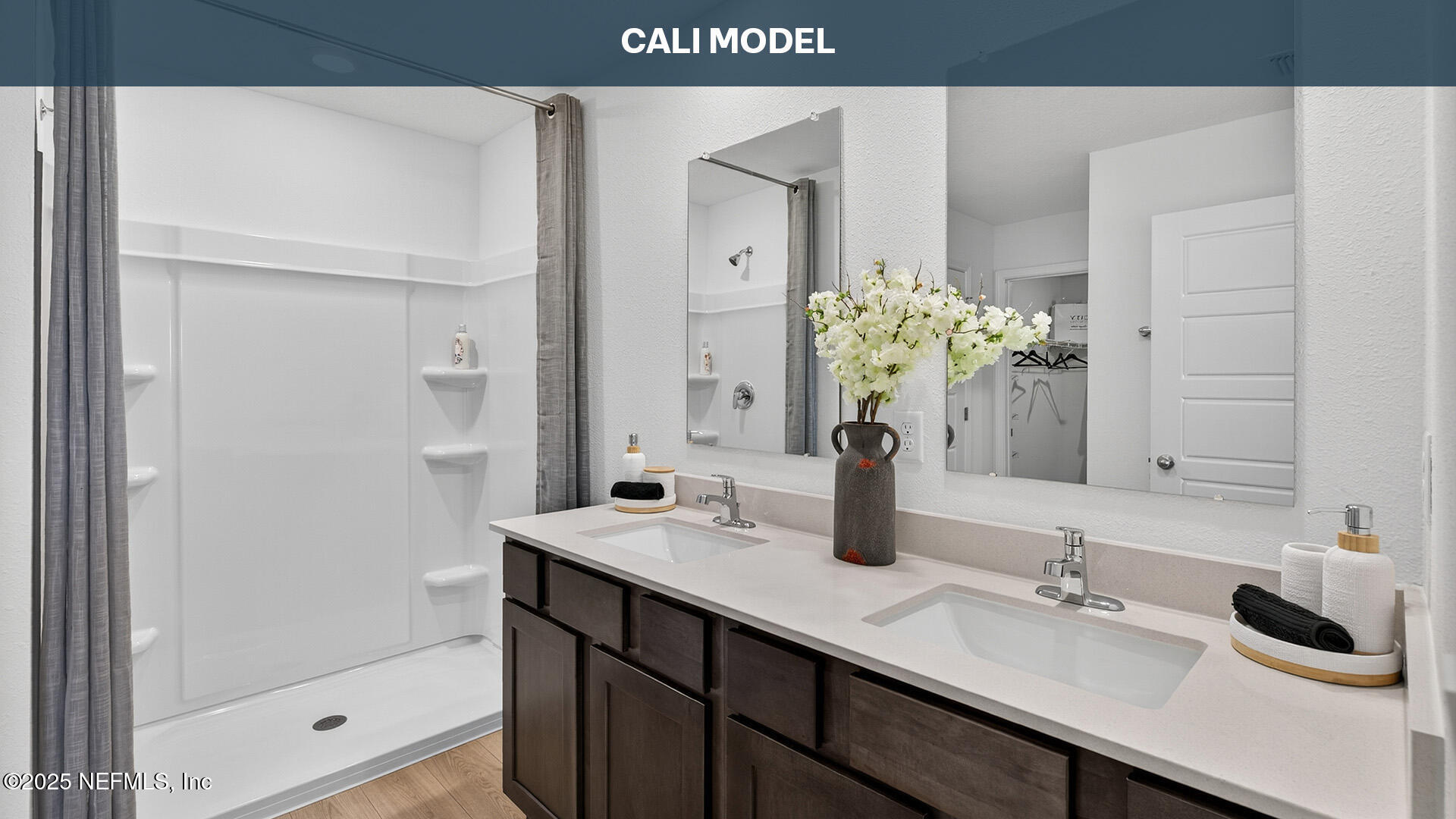 12397 Great Eagle Road Jacksonville, FL 32219 - Photo 16 of 63 a bathroom with a double vanity sink and a mirror