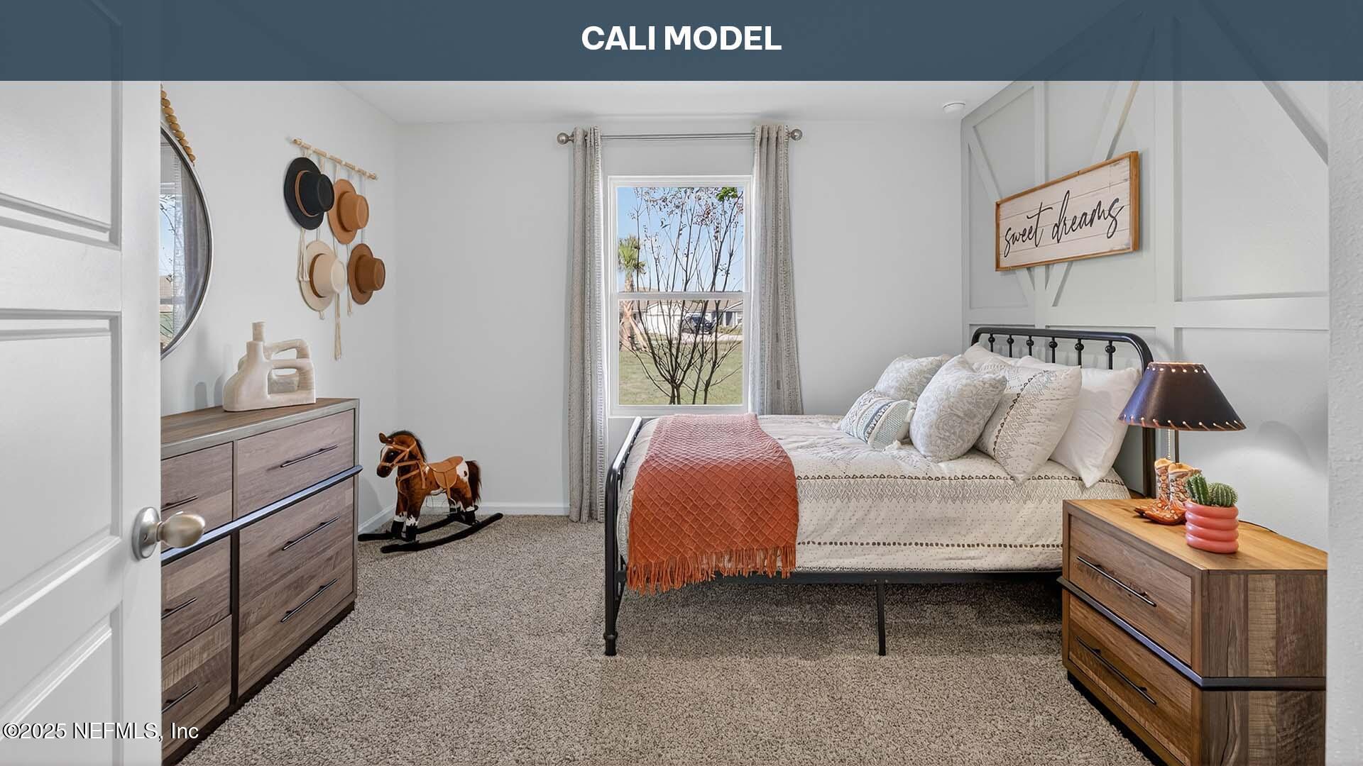 12397 Great Eagle Road Jacksonville, FL 32219 - Photo 20 of 63 a bedroom with a bed and a painting on the wall