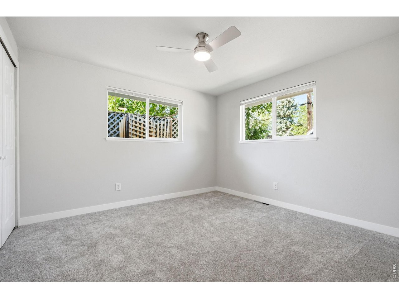 1035 6th Street Berthoud, CO 80513 - Photo 27 of 37 a view of an empty room with a window