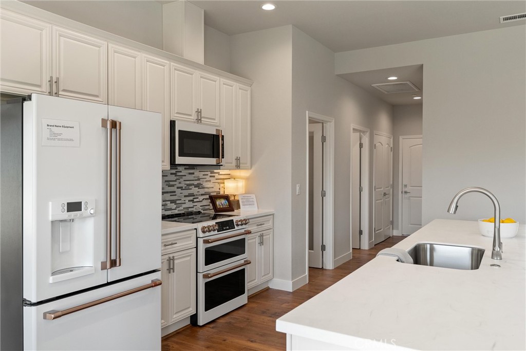 480 Valley View Drive Paradise, CA 95969 - Photo 12 of 48 a kitchen with stainless steel appliances kitchen island a refrigerator sink and stove
