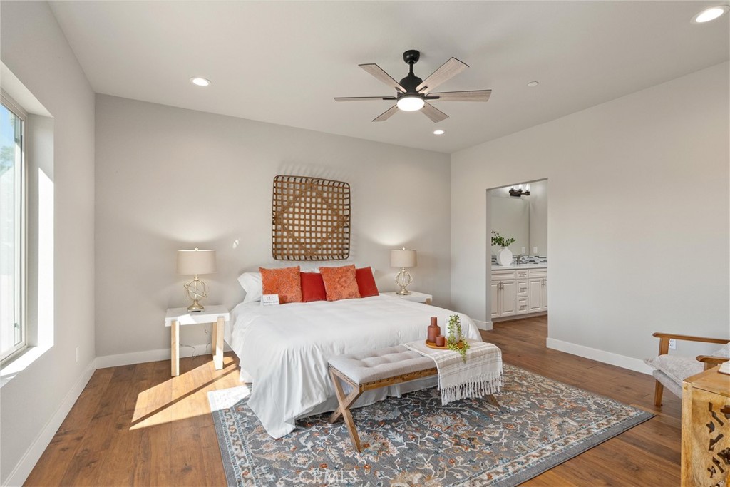 480 Valley View Drive Paradise, CA 95969 - Photo 21 of 48 a bedroom with a bed and wooden floor