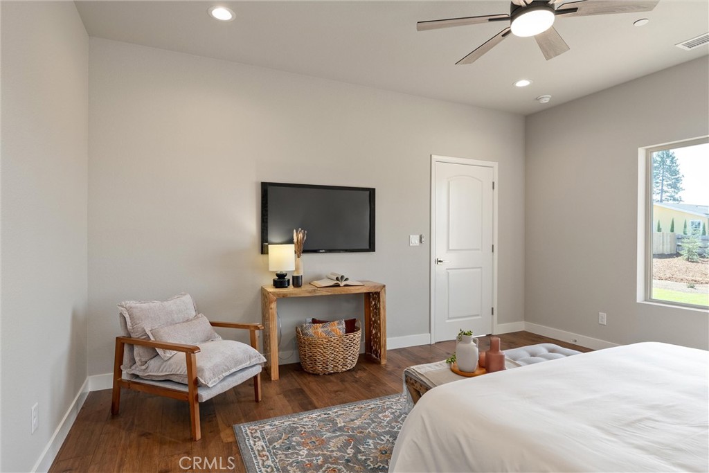 480 Valley View Drive Paradise, CA 95969 - Photo 22 of 48 a bedroom with a bed and a flat screen tv