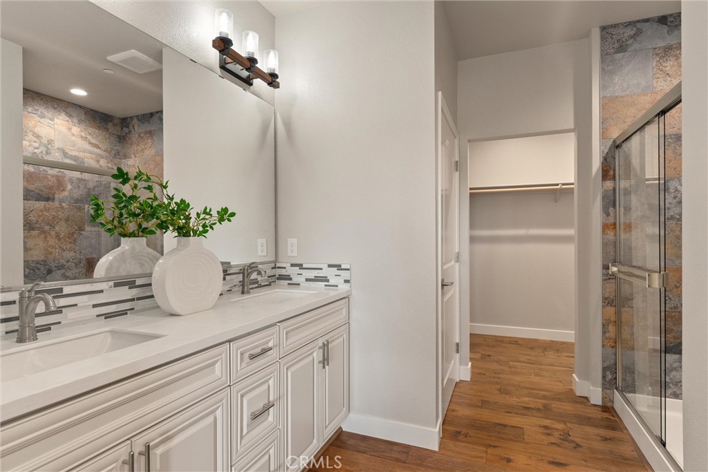 480 Valley View Drive Paradise, CA 95969 - Photo 23 of 48 a bathroom with a granite countertop sink a mirror and a shower
