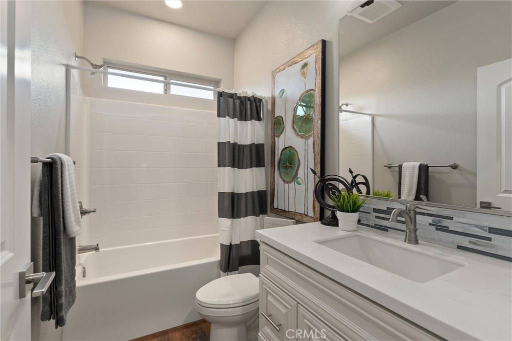 480 Valley View Drive Paradise, CA 95969 - Photo 27 of 48 a bathroom with a sink a toilet a mirror and shower