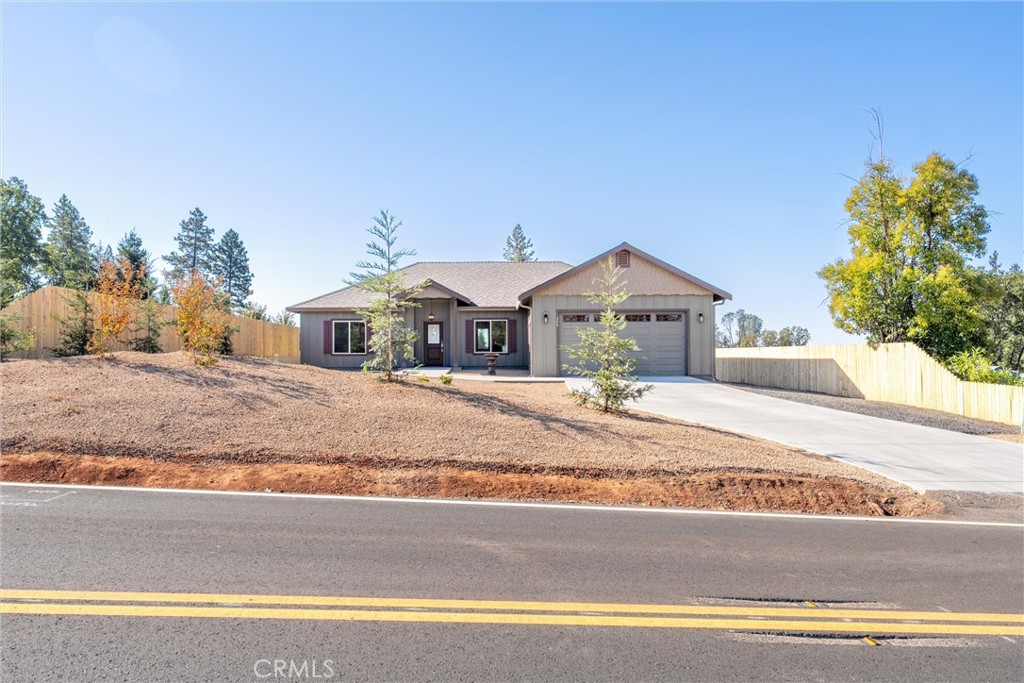 480 Valley View Drive Paradise, CA 95969 - Photo 33 of 48 a house with a yard and a large parking space