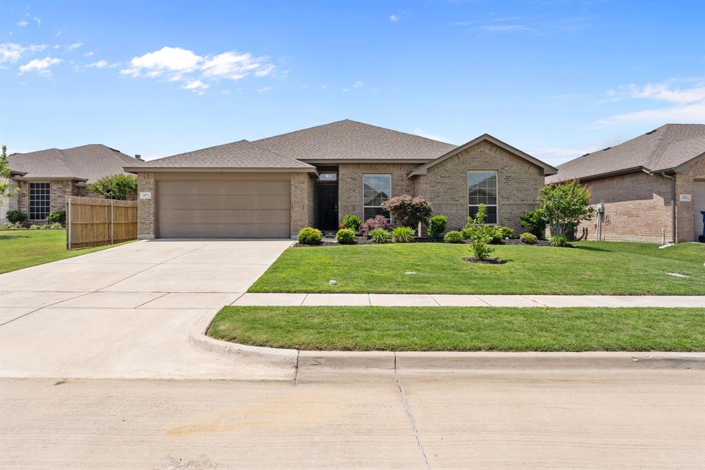 217 Angelina Court Azle, TX 76020 - Photo 1 of 34 a front view of a house with a yard and garage