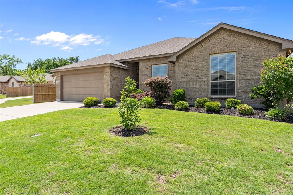 217 Angelina Court Azle, TX 76020 - Photo 2 of 34 a front view of house with garden
