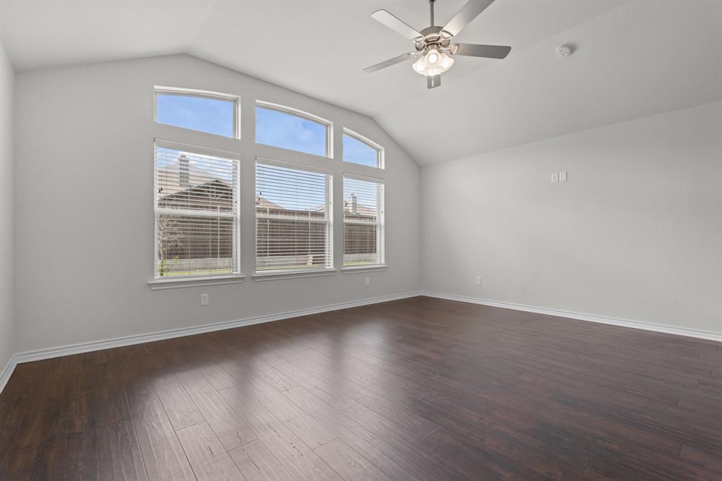 217 Angelina Court Azle, TX 76020 - Photo 22 of 34 a view of an empty room with wooden floor and a window