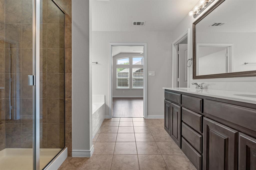 217 Angelina Court Azle, TX 76020 - Photo 24 of 34 a bathroom with a sink a toilet and shower