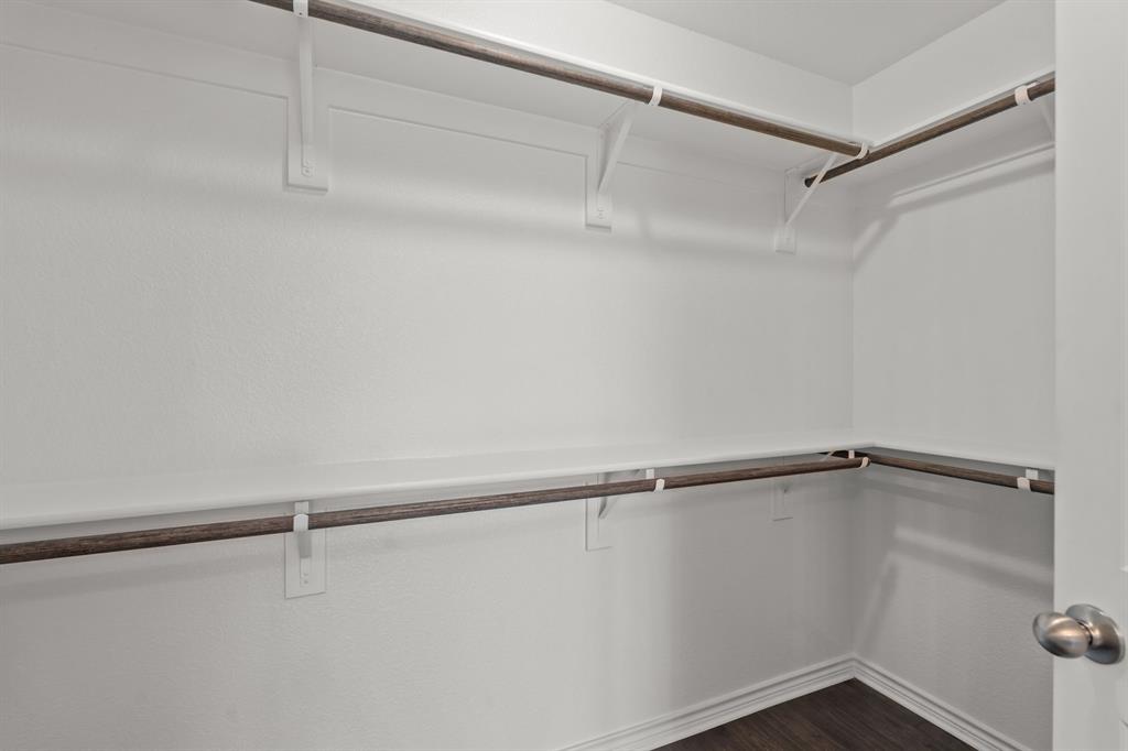 217 Angelina Court Azle, TX 76020 - Photo 27 of 34 a view of a room with racks on the wall