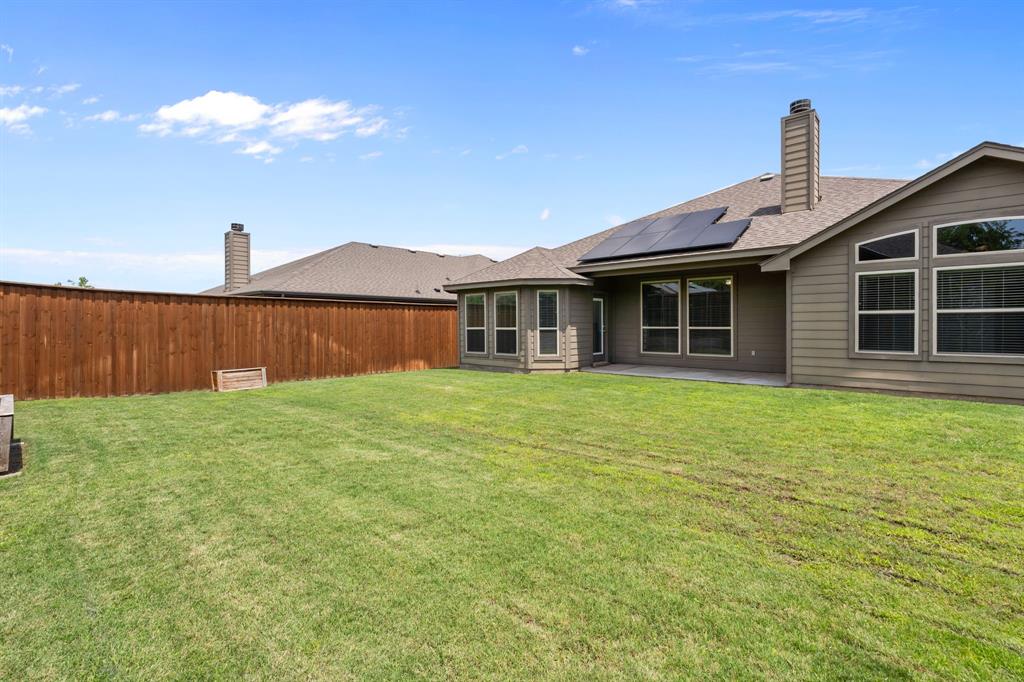 217 Angelina Court Azle, TX 76020 - Photo 31 of 34 a front view of a house with garden