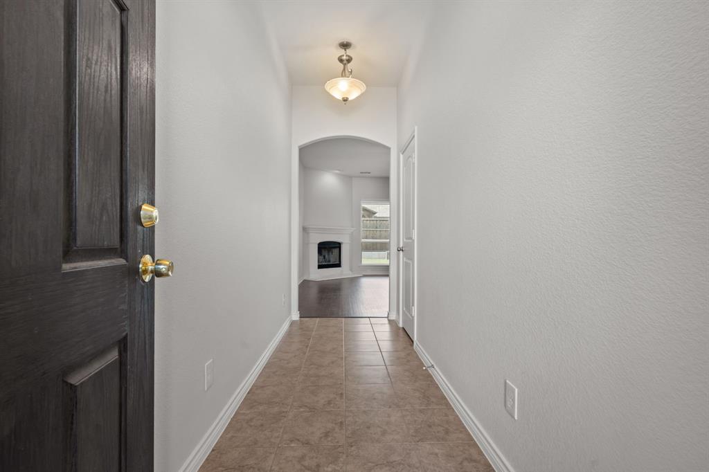 217 Angelina Court Azle, TX 76020 - Photo 4 of 34 a view of a hallway with wooden floor