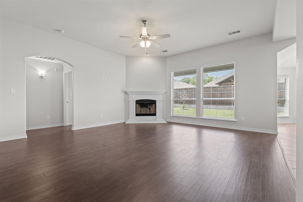 217 Angelina Court Azle, TX 76020 - Photo 7 of 34 a view of an empty room with wooden floor and a window