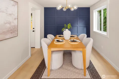a dining room with furniture and window
