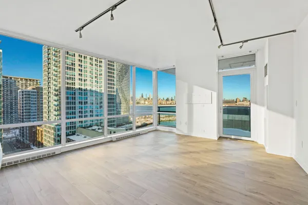 a view of an empty room with a window