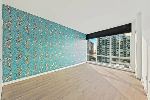 a view of an empty room with a window