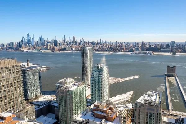 a lake view with a city skyline in the background