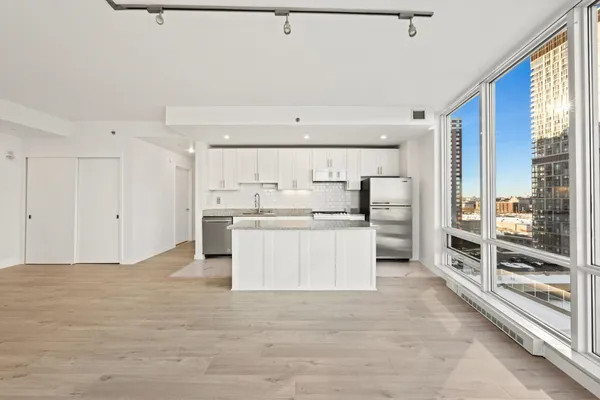a view of kitchen with wooden floor