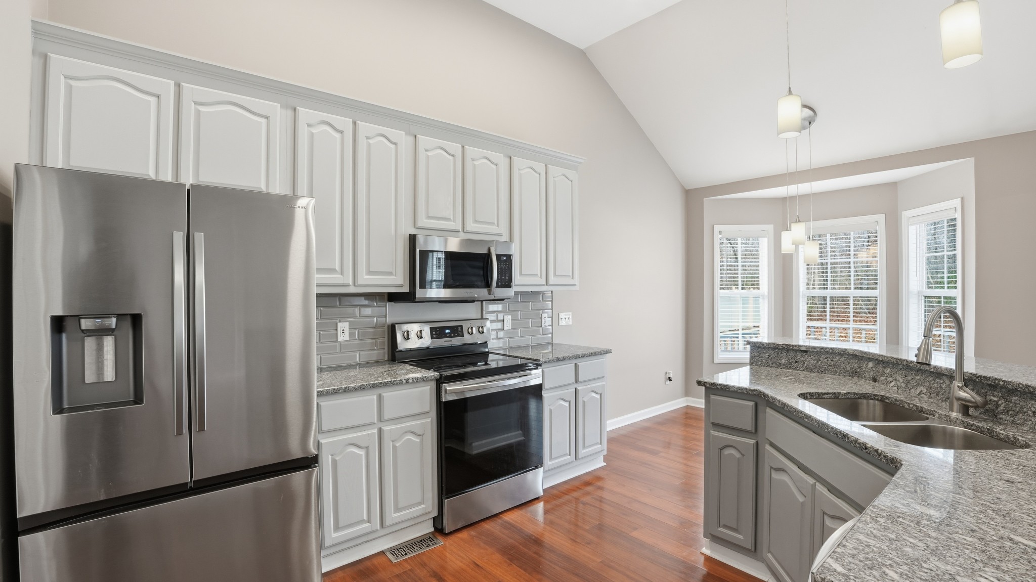 133 Riley Creek Road Tullahoma, TN 37388 - Photo 11 of 42 a kitchen with stainless steel appliances granite countertop a refrigerator stove and sink