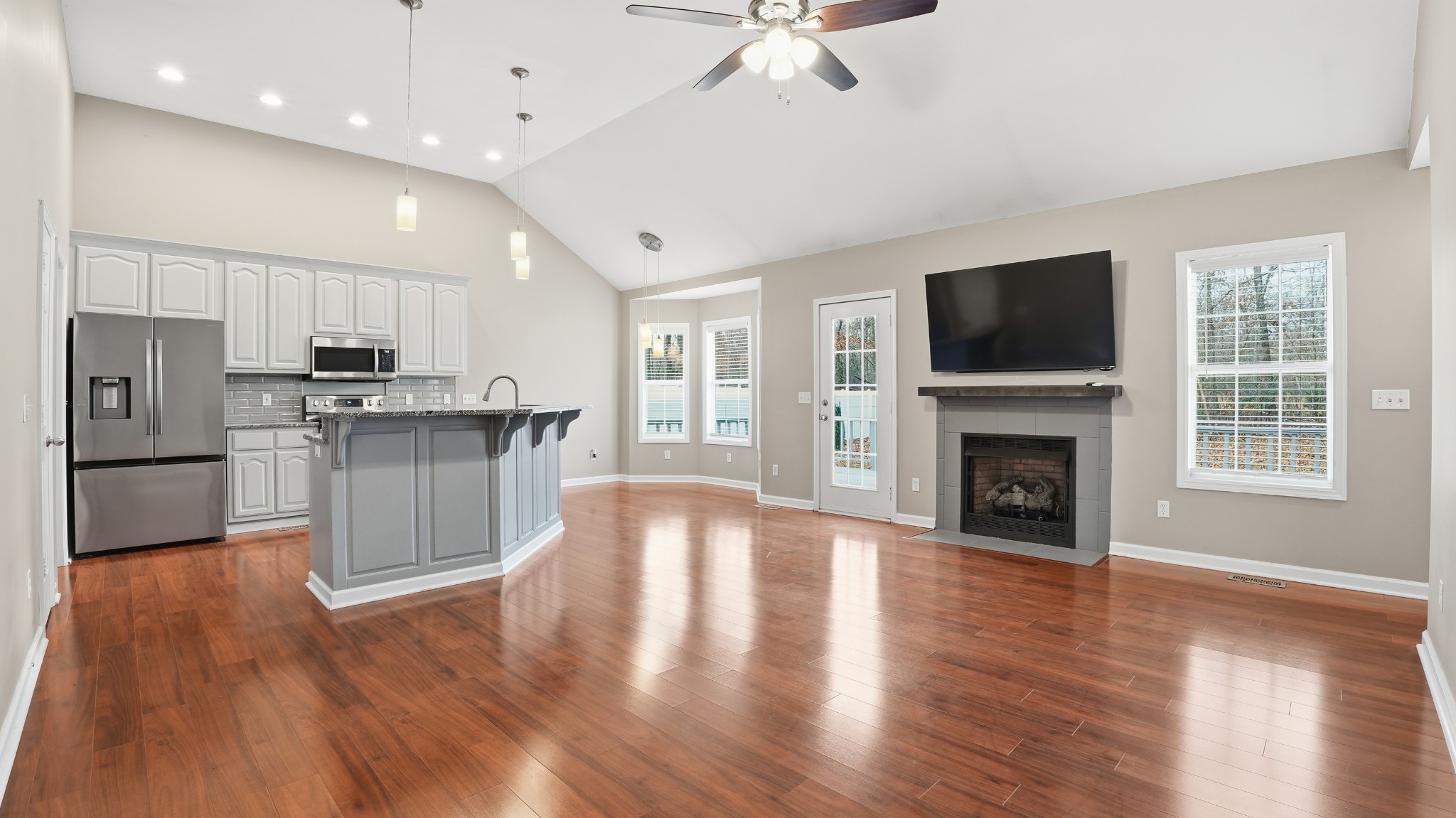 133 Riley Creek Road Tullahoma, TN 37388 - Photo 15 of 42 a view of kitchen with microwave a stove and wooden floor