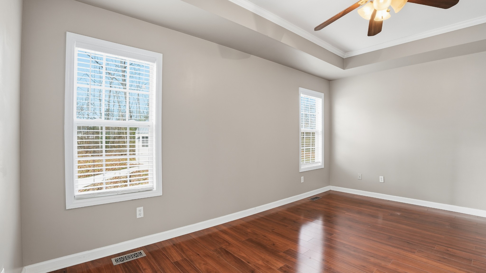 133 Riley Creek Road Tullahoma, TN 37388 - Photo 17 of 42 a view of an empty room with wooden floor and a window