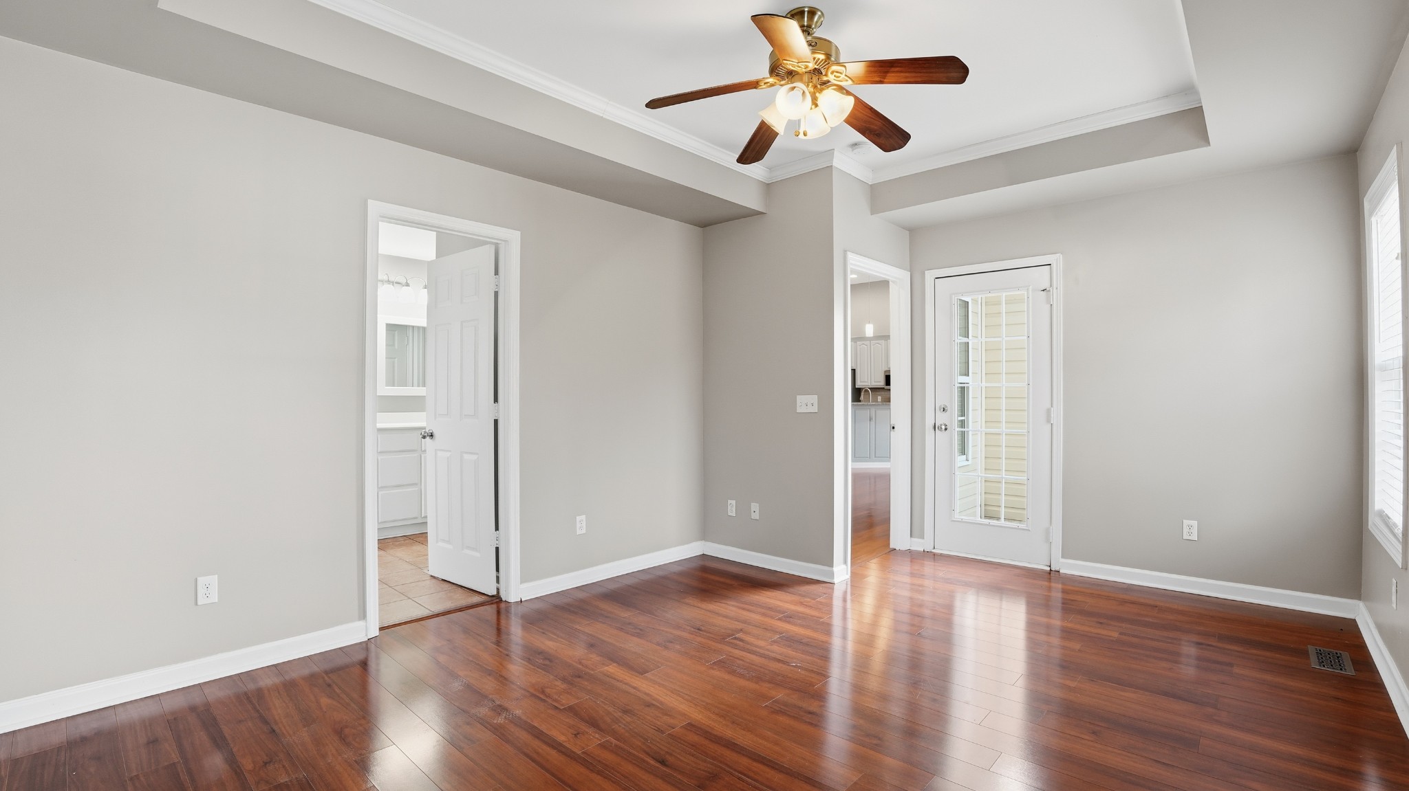 133 Riley Creek Road Tullahoma, TN 37388 - Photo 18 of 42 an empty room with wooden floor chandelier fan and closet