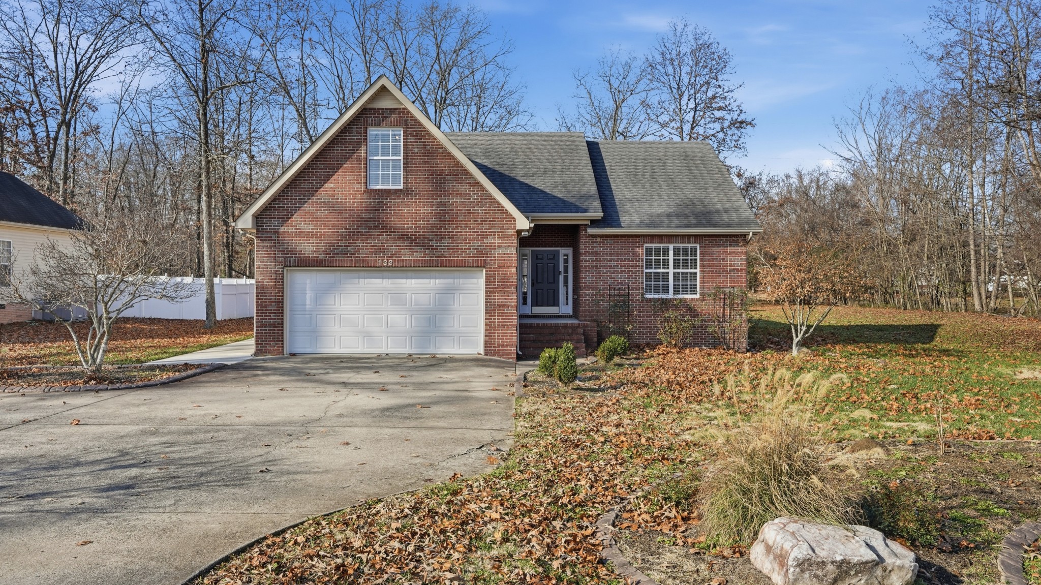 133 Riley Creek Road Tullahoma, TN 37388 - Photo 2 of 42 a front view of a house with garden