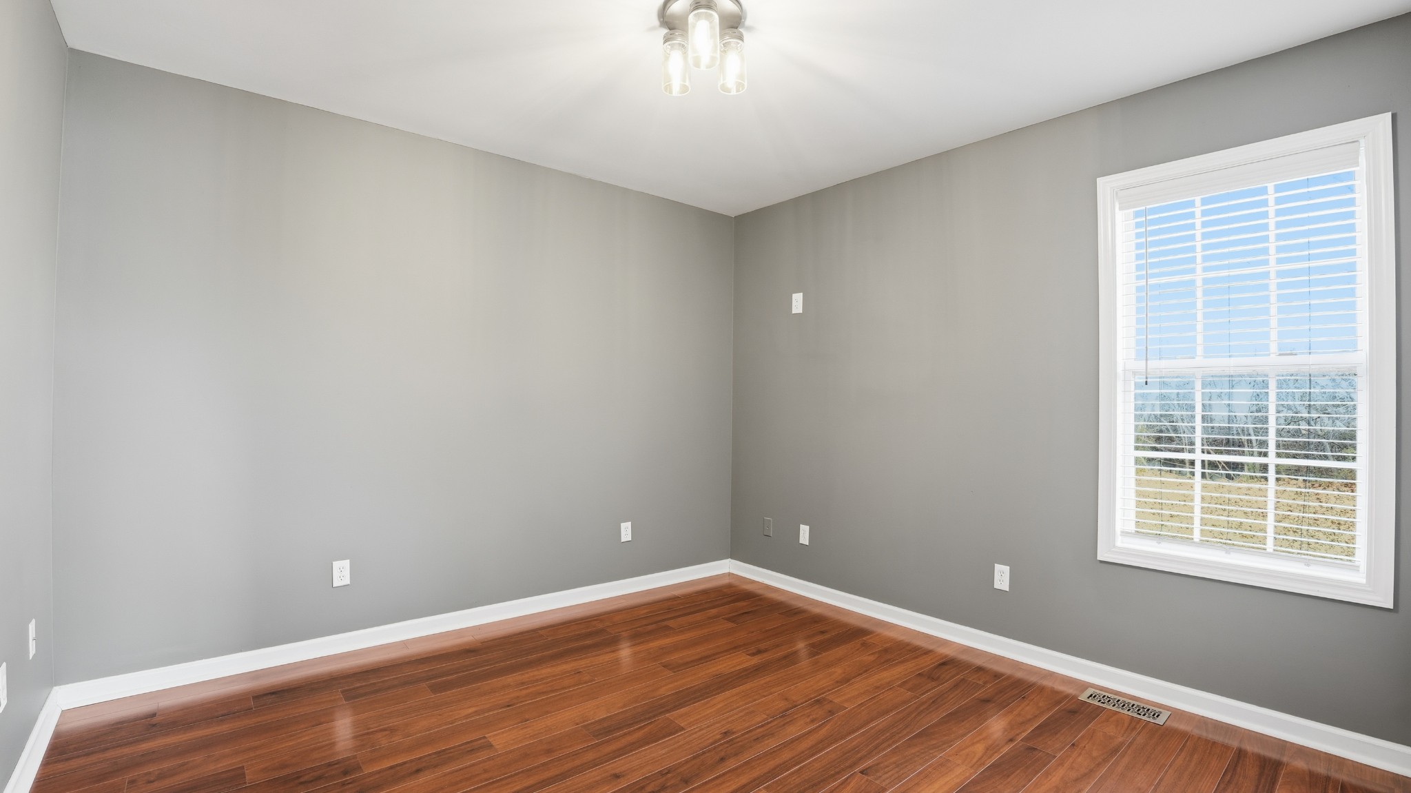 133 Riley Creek Road Tullahoma, TN 37388 - Photo 28 of 42 a view of an empty room with wooden floor and a window