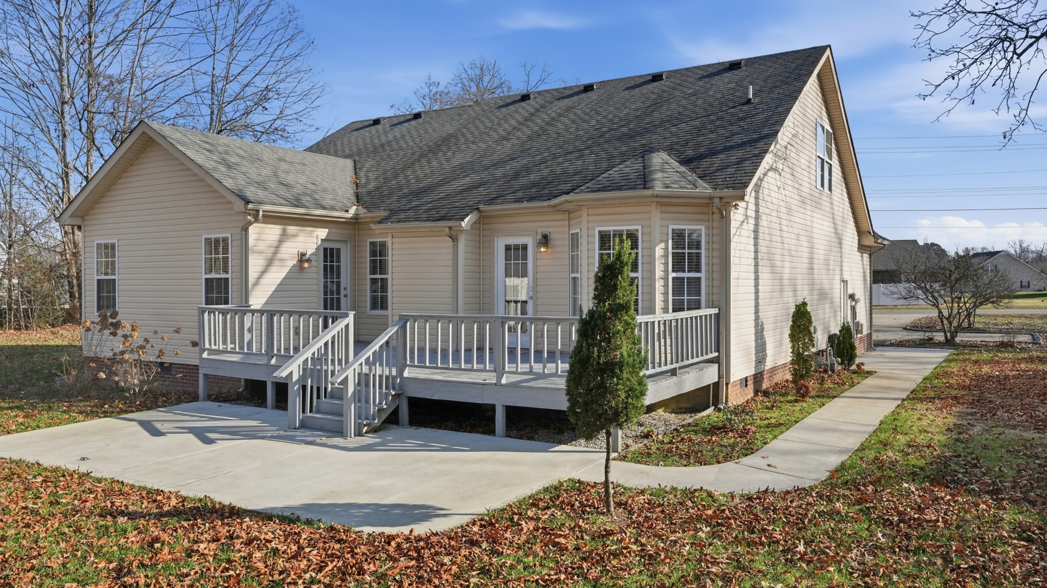 133 Riley Creek Road Tullahoma, TN 37388 - Photo 6 of 42 a view of a house with a small yard and wooden fence