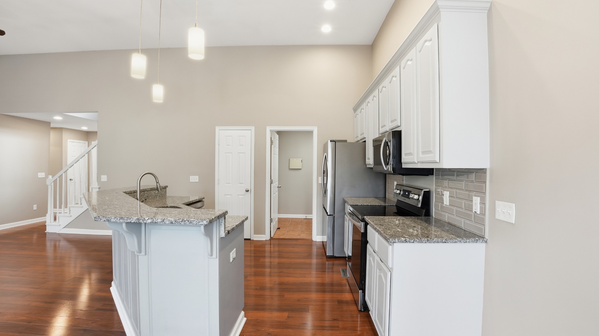 133 Riley Creek Road Tullahoma, TN 37388 - Photo 10 of 42 a kitchen with granite countertop a sink stainless steel appliances and cabinets