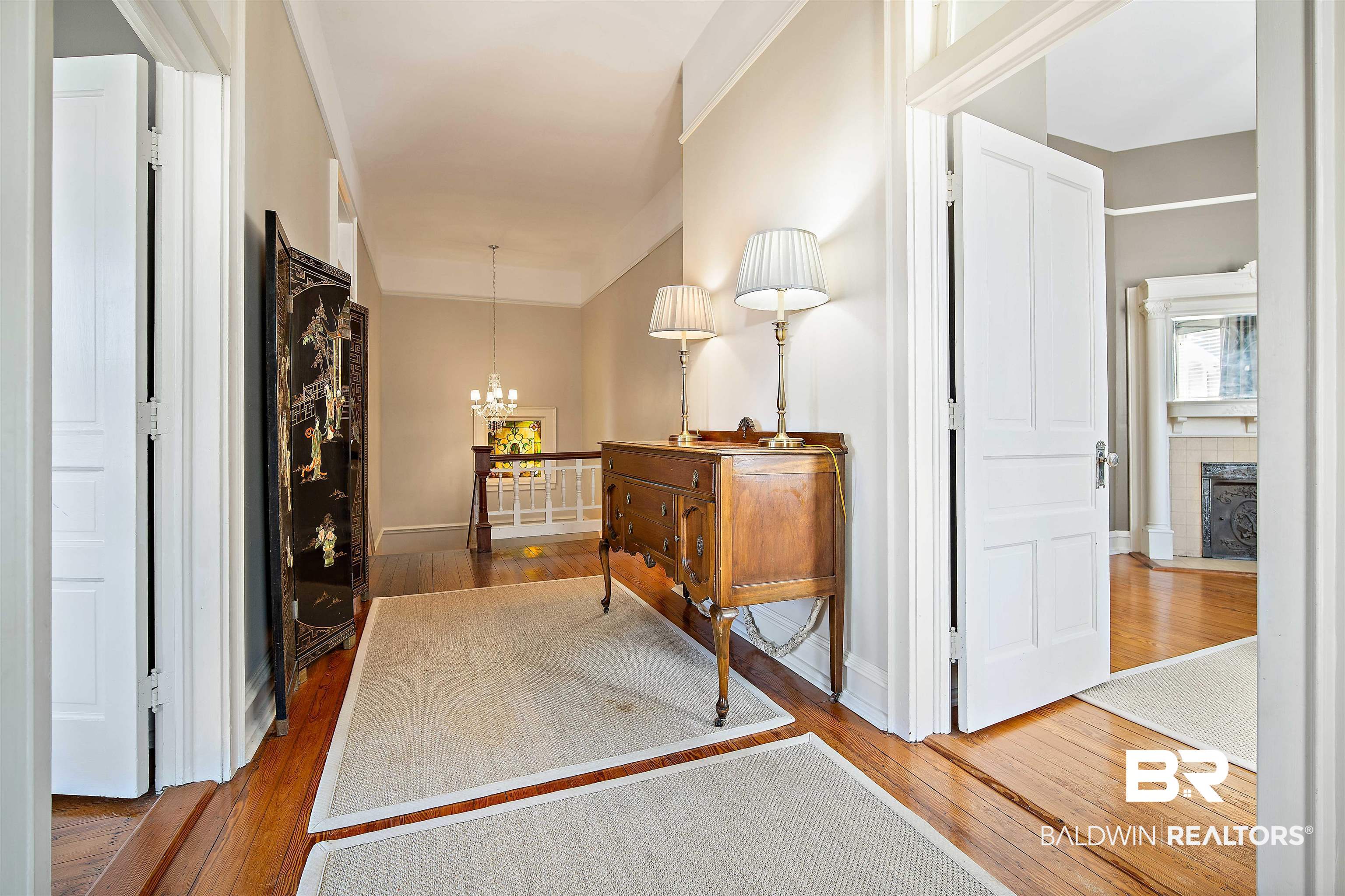 1314 Dauphin Street Mobile, AL 36604 - Photo 32 of 61 Parlor featuring a chandelier and hardwood flooring