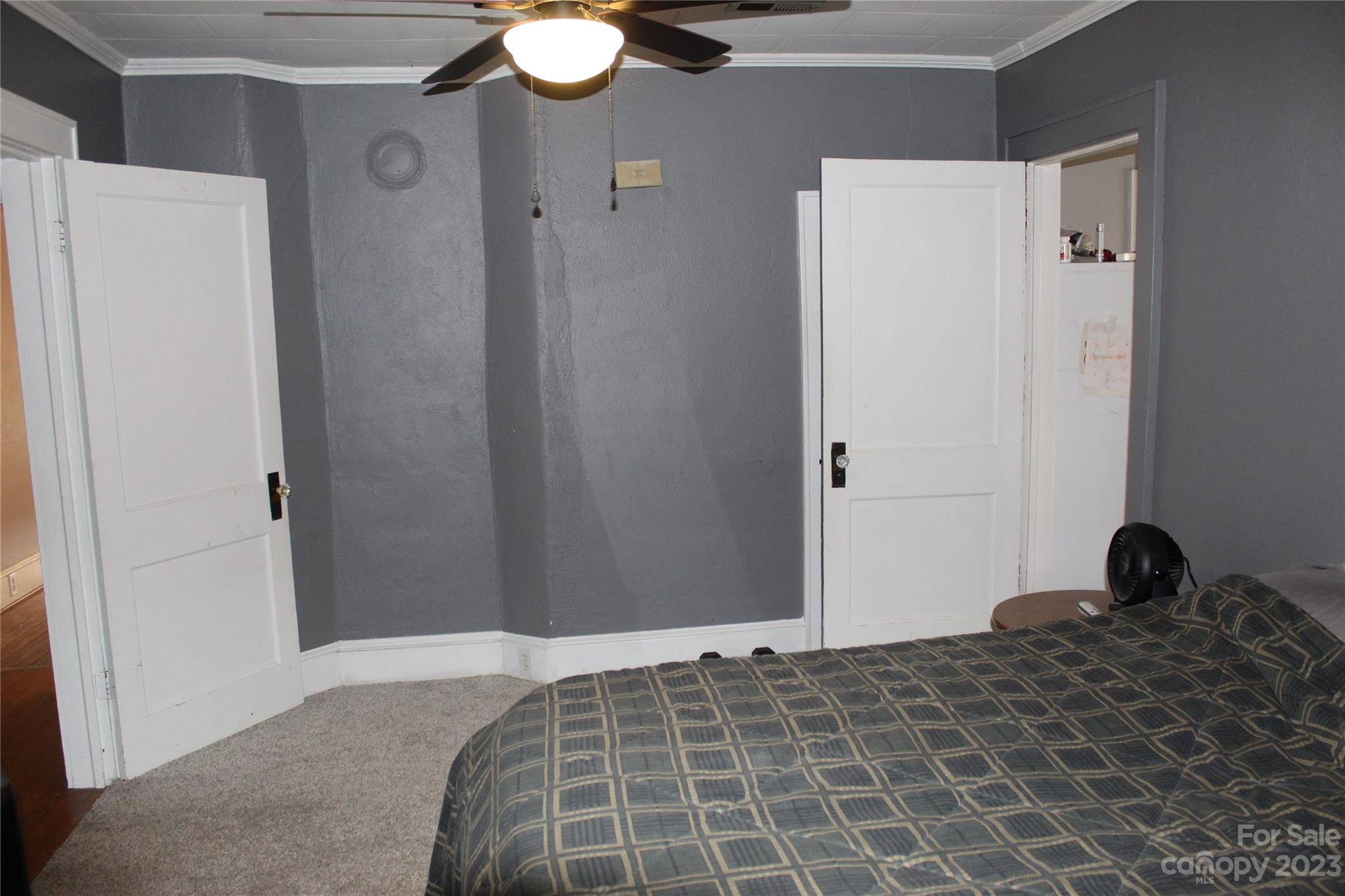 280 Bostic Yard Road Bostic, NC 28018 - Photo 13 of 34 a bedroom with a bed and a chandelier