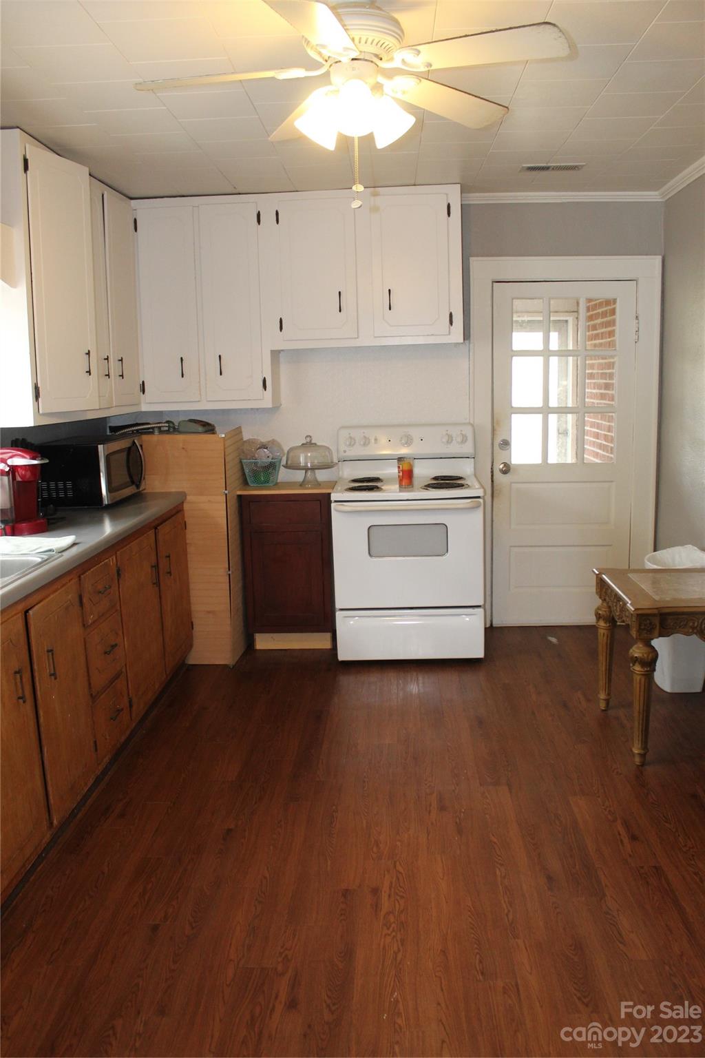 280 Bostic Yard Road Bostic, NC 28018 - Photo 14 of 34 a kitchen with granite countertop white cabinets and white appliances