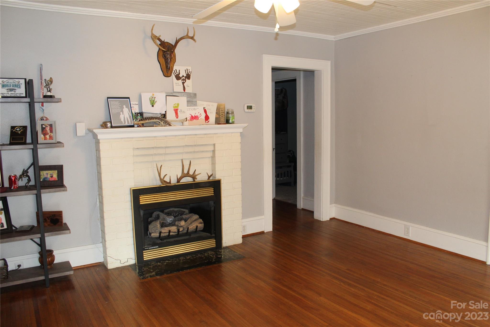 280 Bostic Yard Road Bostic, NC 28018 - Photo 19 of 34 a living room with a fireplace with wooden floor