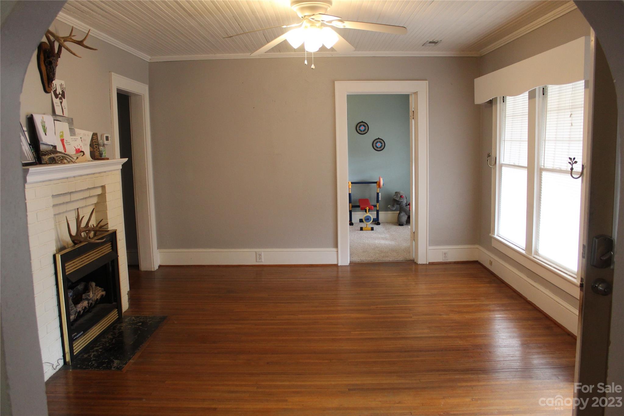 280 Bostic Yard Road Bostic, NC 28018 - Photo 5 of 34 a view of a livingroom with wooden floor and a fireplace