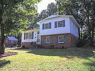 2428 Remington Road Raleigh, NC 27610 - Photo 1 of 1 a front view of a house with a yard