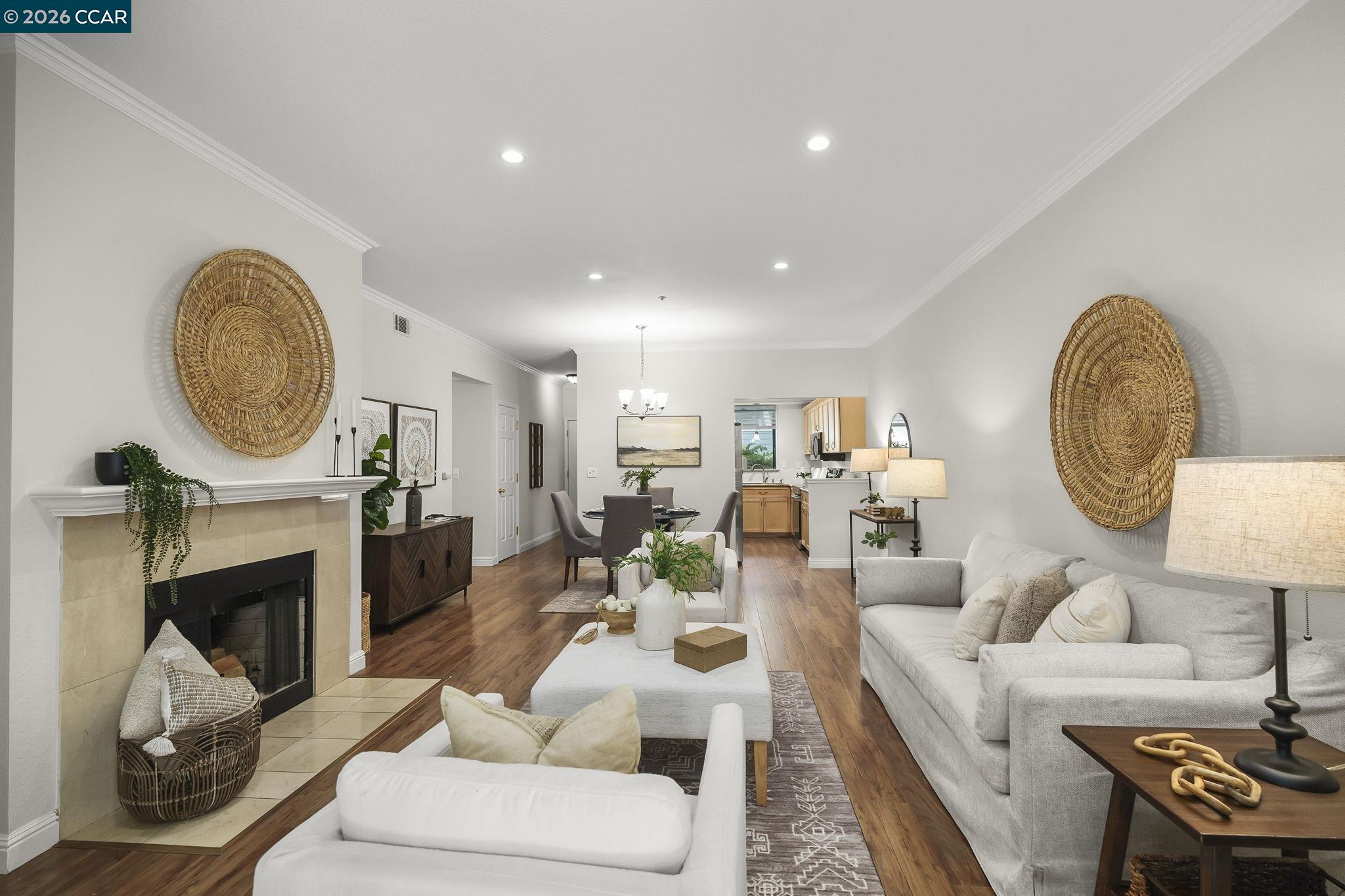 2586 Oak Road, Unit 130 Walnut Creek, CA 94597 - Photo 6 of 31 a living room with furniture a fireplace and a fireplace