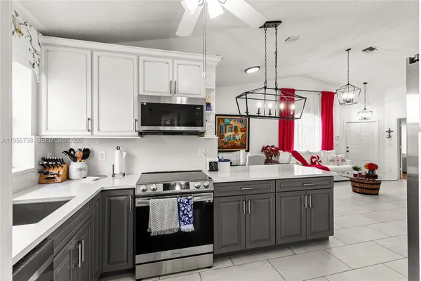 a kitchen with a sink and cabinets