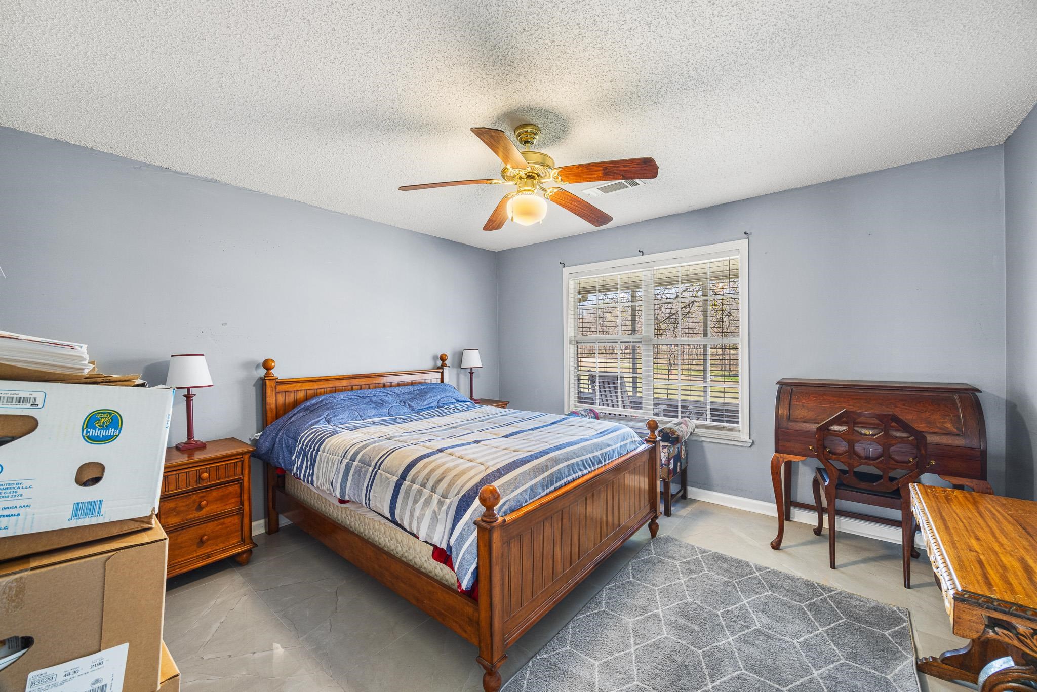 149 Abby Road Drummonds, TN 38023 - Photo 24 of 38 Bedroom featuring ceiling fan and a textured ceiling