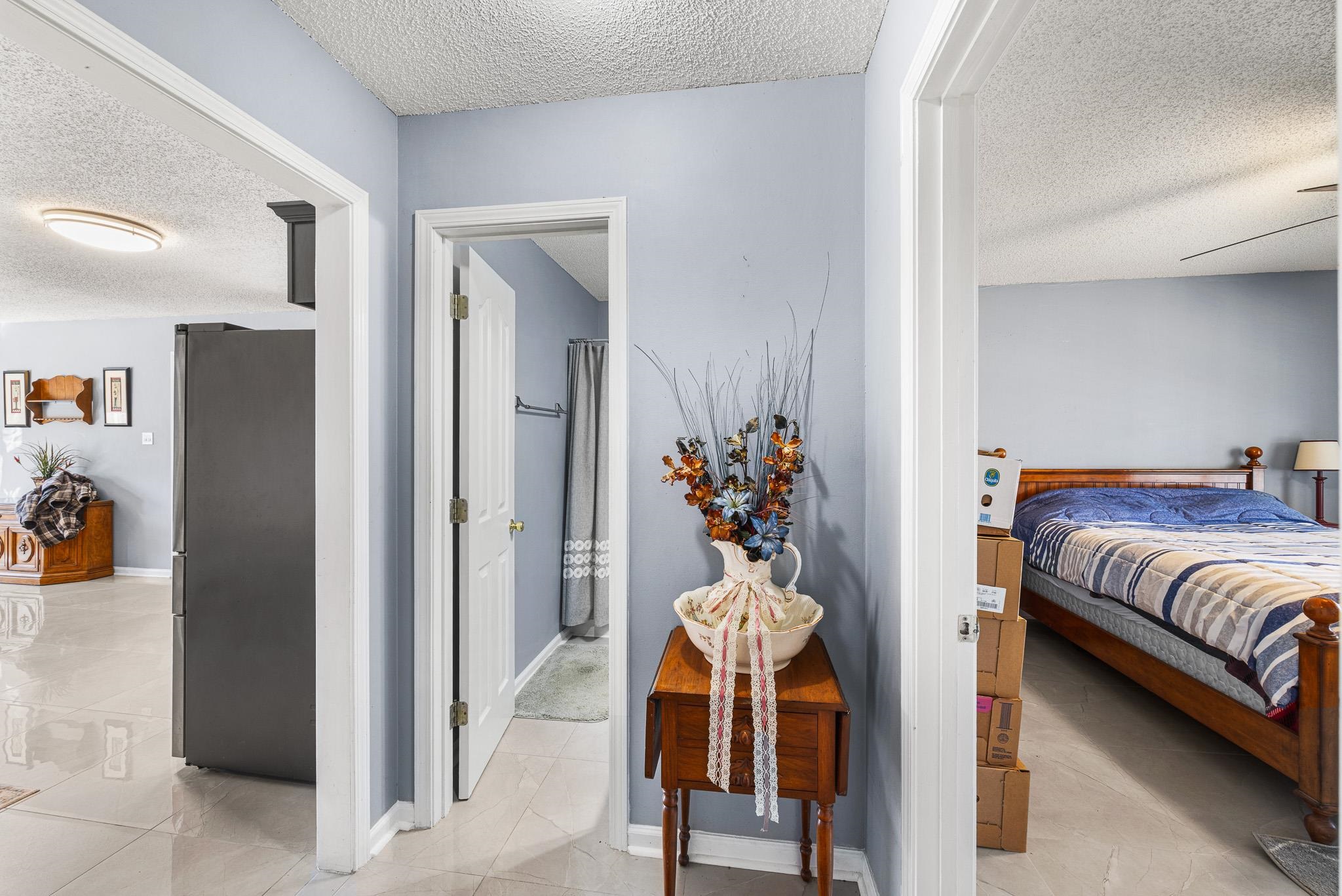 149 Abby Road Drummonds, TN 38023 - Photo 25 of 38 Hallway featuring a textured ceiling