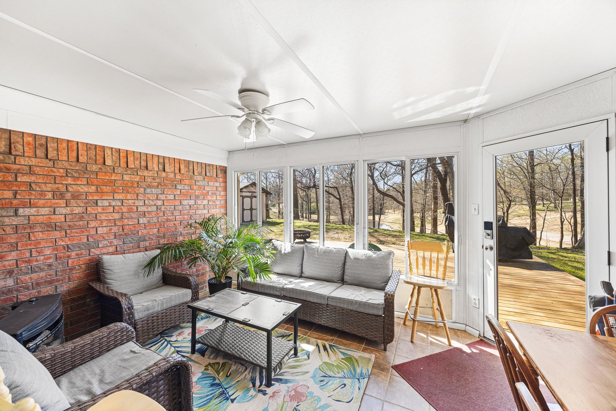 149 Abby Road Drummonds, TN 38023 - Photo 31 of 38 Sunroom featuring an outdoor living space and a ceiling fan