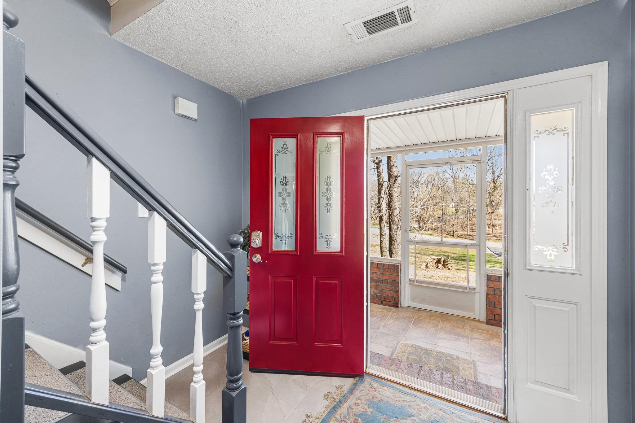 149 Abby Road Drummonds, TN 38023 - Photo 4 of 38 Foyer featuring stairway and a textured ceiling