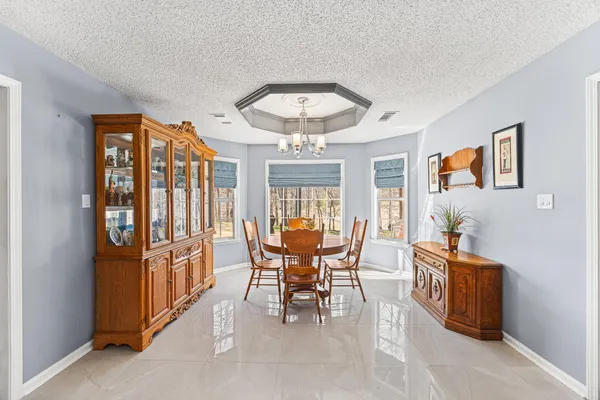 a view of a dining room with furniture window and outside view