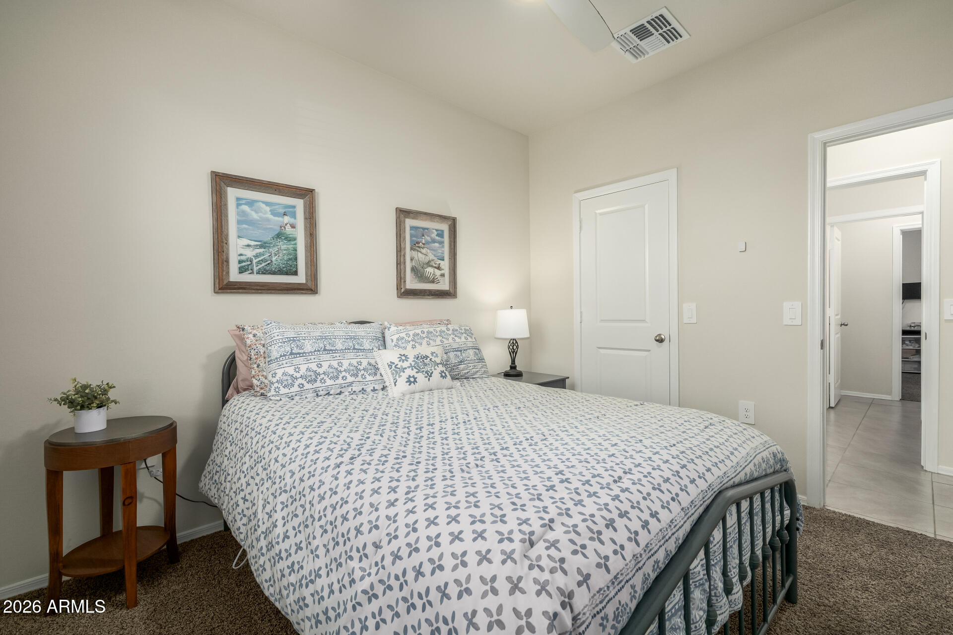 9471 Greenhouse Road Florence, AZ 85132 - Photo 14 of 22 a bedroom with a bed and a table in it