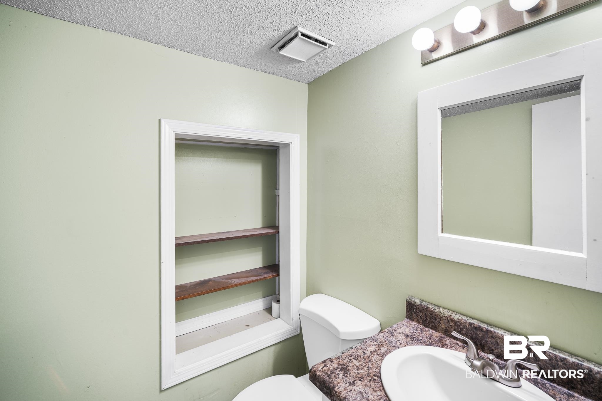 6513 Cedar Bend Court, Unit B Mobile, AL 36608 - Photo 9 of 23 Half Bath off of Kitchen